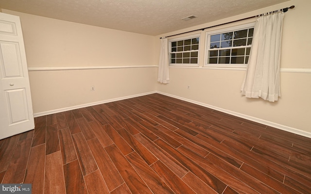 8110 Winter Blue Ct, Springfield, VA 22153 - unfurnished room with dark wood-type flooring, a textured ceiling, and baseboards