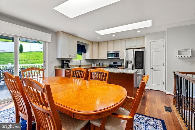 3195 Atlee Ridge Rd, New Windsor, MD 21776 - dining space featuring a skylight, wood finished floors, and recessed lighting