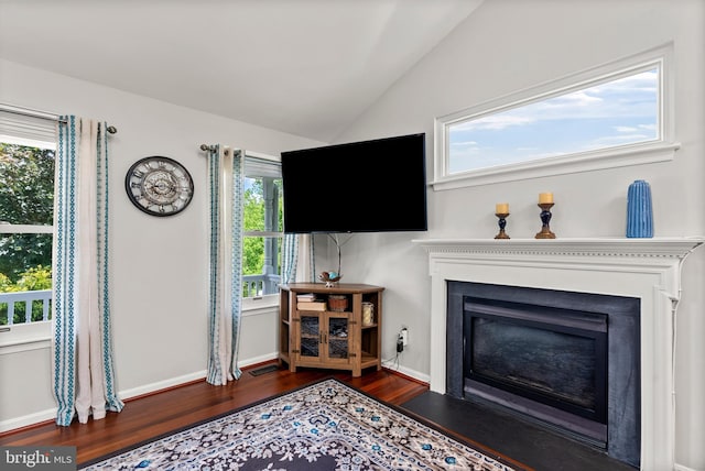 3195 Atlee Ridge Rd, New Windsor, MD 21776 - living room with wood finished floors, a fireplace with flush hearth, vaulted ceiling, and baseboards