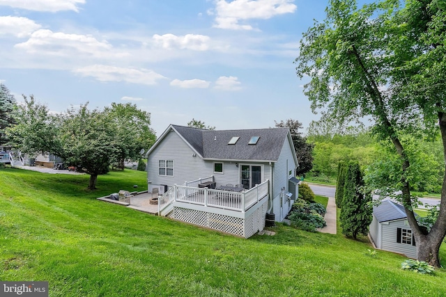 3195 Atlee Ridge Rd, New Windsor, MD 21776 - rear view of house featuring a wooden deck, a lawn, roof with shingles, and an outbuilding
