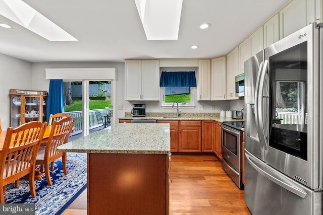 3195 Atlee Ridge Rd, New Windsor, MD 21776 - kitchen with appliances with stainless steel finishes, a skylight, a sink, healthy amount of natural light, and recessed lighting