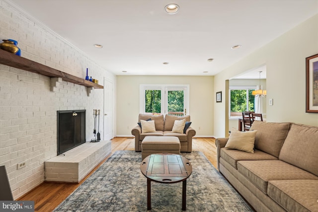 10127 Hillington Ct, Vienna, VA 22182 - living room featuring wood finished floors, a fireplace, recessed lighting, and baseboards