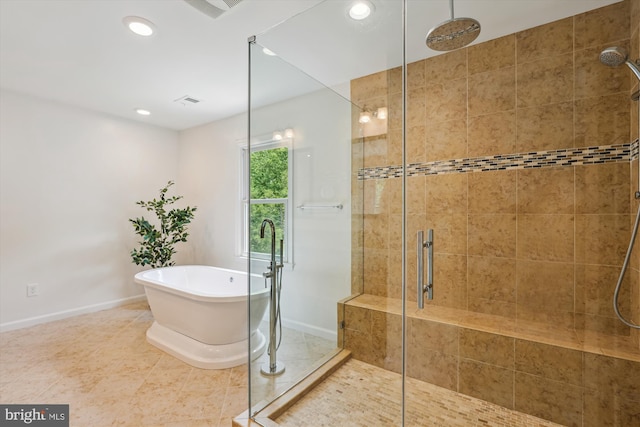 10127 Hillington Ct, Vienna, VA 22182 - bathroom featuring a shower stall, baseboards, a freestanding bath, recessed lighting, and tile patterned floors
