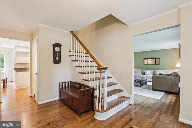 10127 Hillington Ct, Vienna, VA 22182 - stairs with wood finished floors, ornamental molding, and baseboards