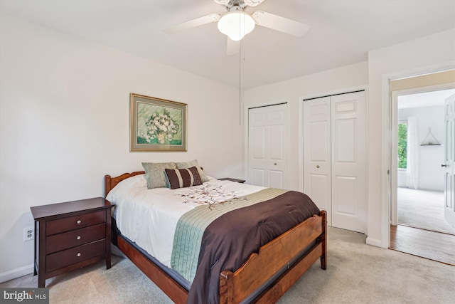 10127 Hillington Ct, Vienna, VA 22182 - bedroom featuring carpet floors, two closets, baseboards, and ceiling fan