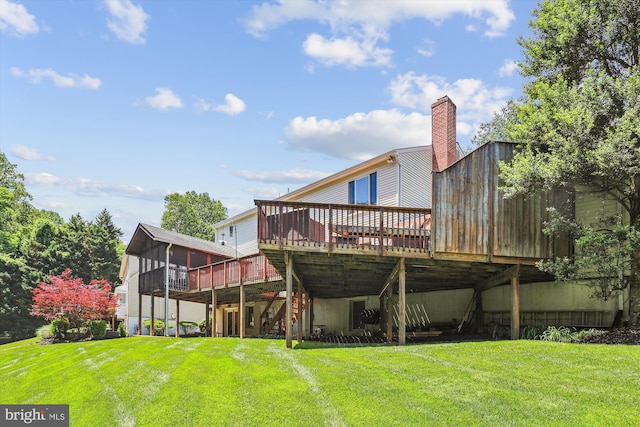 10127 Hillington Ct, Vienna, VA 22182 - back of house featuring a deck, a yard, and a sunroom