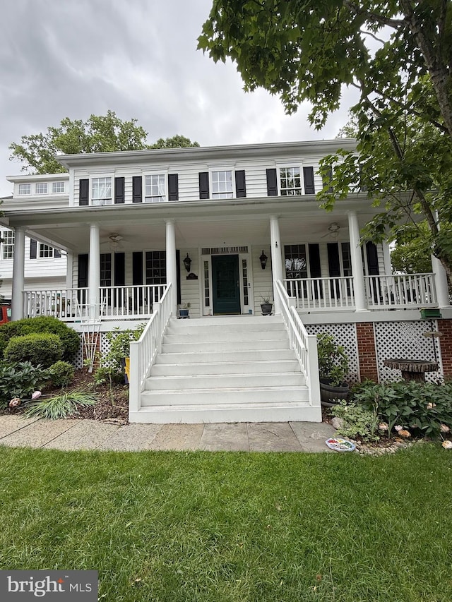 850 Still Creek Ln, Gaithersburg, MD 20878 - view of front of house with stairway, covered porch, and a front yard
