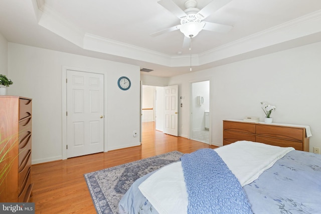 850 Still Creek Ln, Gaithersburg, MD 20878 - bedroom featuring a tray ceiling, light wood-style floors, ornamental molding, baseboards, and connected bathroom