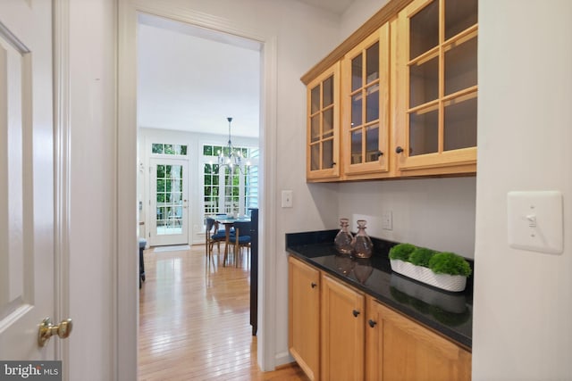 850 Still Creek Ln, Gaithersburg, MD 20878 - indoor dry bar with a chandelier and light wood-style floors