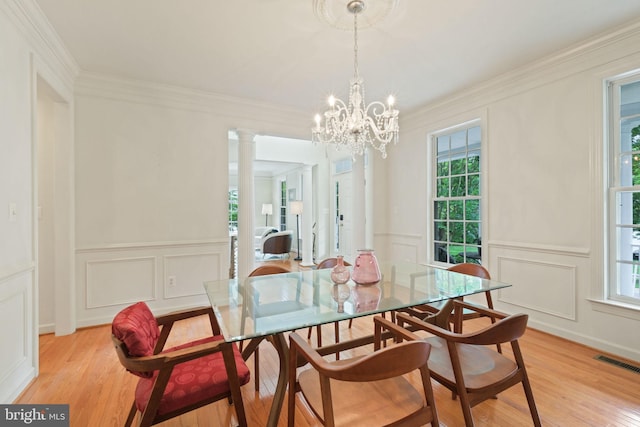 850 Still Creek Ln, Gaithersburg, MD 20878 - dining area featuring a decorative wall, healthy amount of natural light, light wood finished floors, ornamental molding, and a chandelier