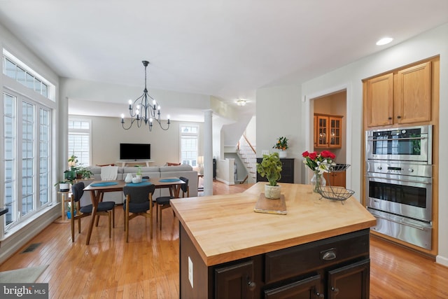 850 Still Creek Ln, Gaithersburg, MD 20878 - kitchen with a warming drawer, stainless steel double oven, wooden counters, light wood-style flooring, and open floor plan