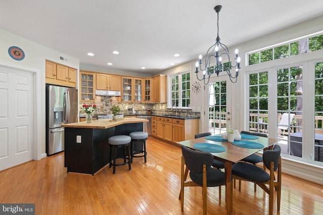 850 Still Creek Ln, Gaithersburg, MD 20878 - dining room with healthy amount of natural light, light wood-type flooring, a chandelier, and recessed lighting