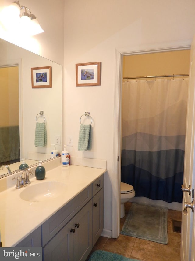 20172 Trap Pond Ct, Millville, DE 19967 - bathroom with vanity, toilet, tile patterned floors, and a shower with shower curtain