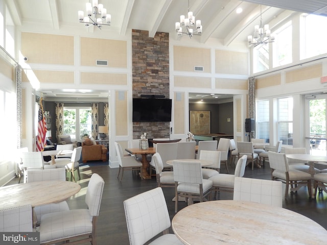20172 Trap Pond Ct, Millville, DE 19967 - dining area featuring a chandelier, a towering ceiling, plenty of natural light, beamed ceiling, and wood finished floors
