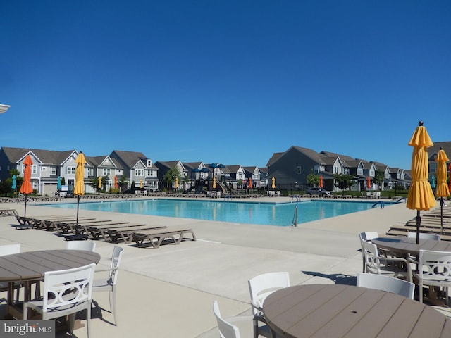 20172 Trap Pond Ct, Millville, DE 19967 - community pool featuring a residential view and a patio