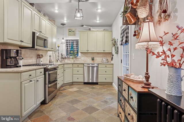 2 Broad St, Stockton, NJ 08559 - kitchen featuring stainless steel appliances, tasteful backsplash, cream cabinets, pendant lighting, and light stone countertops