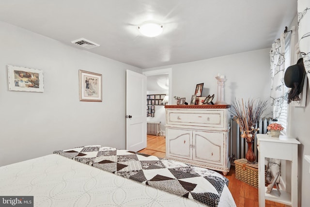 2 Broad St, Stockton, NJ 08559 - bedroom featuring radiator and light wood-type flooring