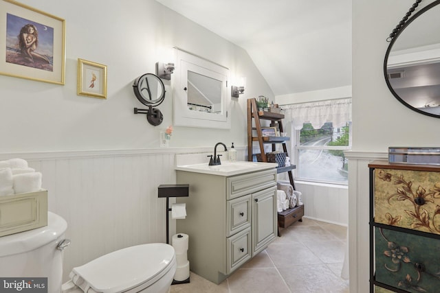 2 Broad St, Stockton, NJ 08559 - bathroom with toilet, wainscoting, vanity, tile patterned flooring, and vaulted ceiling