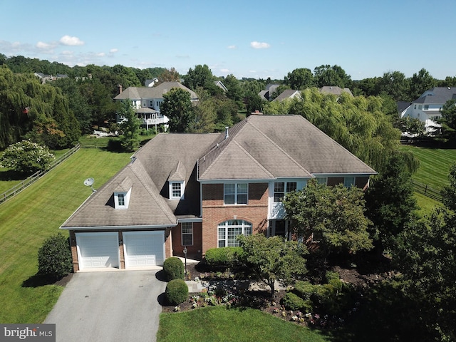 10709 Boswell Ln, Potomac, MD 20854 - view of front of house featuring asphalt driveway, an attached garage, brick siding, and a front lawn