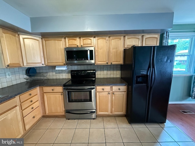 1236 Whittier Ave, Bensalem, PA 19020 - kitchen with appliances with stainless steel finishes, light brown cabinets, light tile patterned flooring, and dark countertops