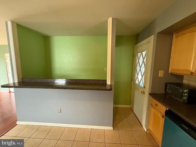1236 Whittier Ave, Bensalem, PA 19020 - kitchen featuring dishwasher, dark countertops, light brown cabinetry, and light tile patterned floors