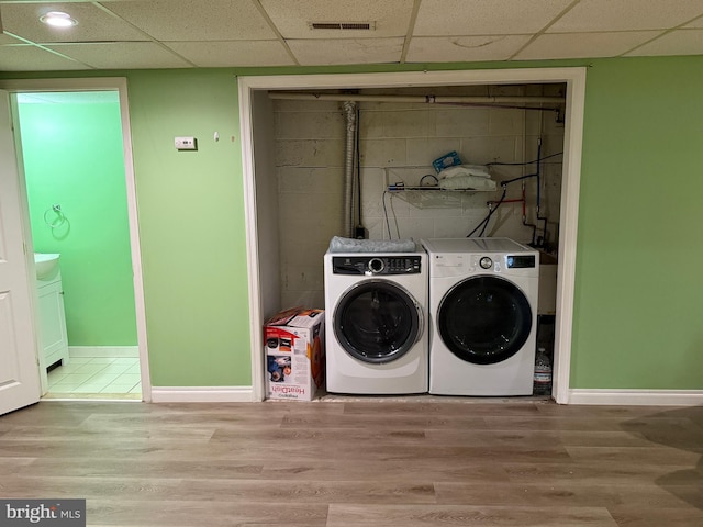 1236 Whittier Ave, Bensalem, PA 19020 - washroom with separate washer and dryer, baseboards, and wood finished floors