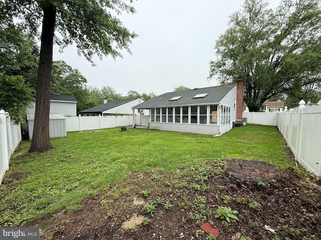 1236 Whittier Ave, Bensalem, PA 19020 - rear view of property with a chimney, roof with shingles, and a sunroom