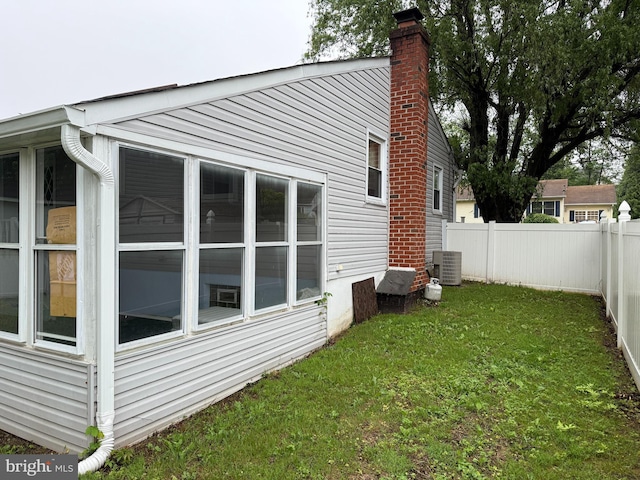 1236 Whittier Ave, Bensalem, PA 19020 - view of property exterior with a chimney and cooling unit