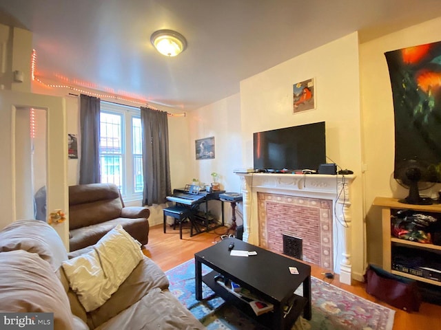 1527 Page St, Philadelphia, PA 19121 - living area with a fireplace and wood finished floors