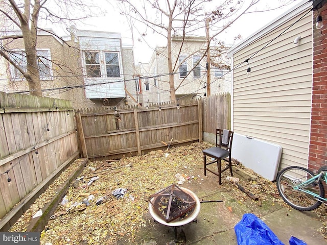 1527 Page St, Philadelphia, PA 19121 - fenced backyard with an outdoor fire pit