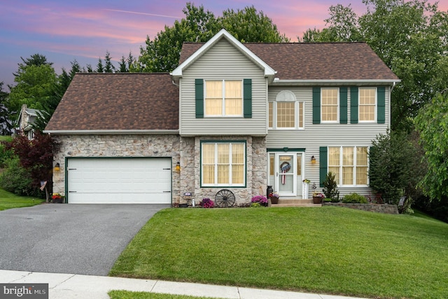 412 Hemlock Dr, New Cumberland, PA 17070 - view of front of property featuring driveway, an attached garage, a front lawn, stone siding, and roof with shingles