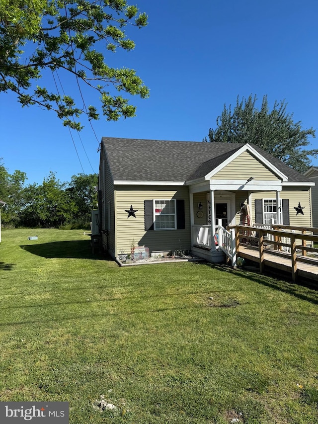 72 Maryland Ave, Crisfield, MD 21817 - view of front of property with a front lawn and roof with shingles