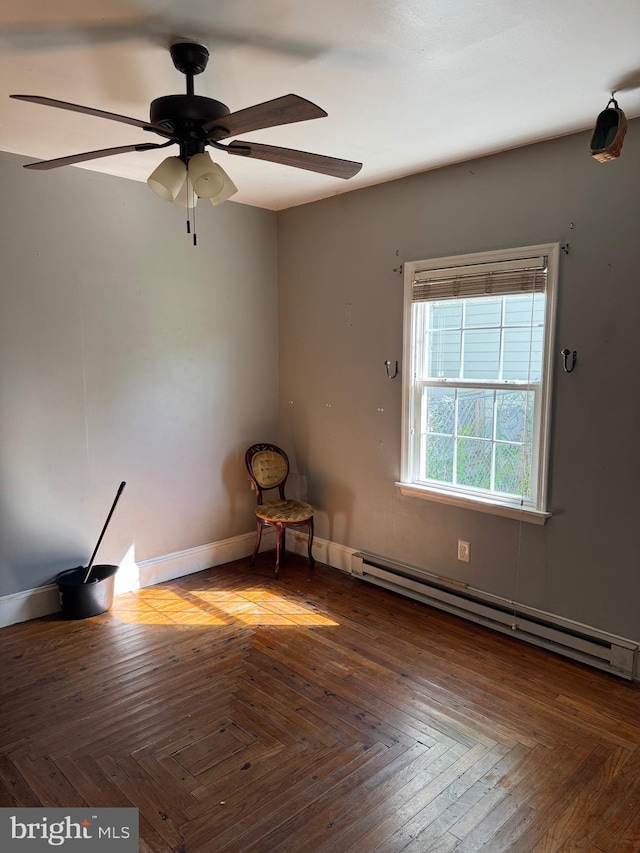 72 Maryland Ave, Crisfield, MD 21817 - unfurnished room featuring a baseboard radiator, a ceiling fan, and baseboards