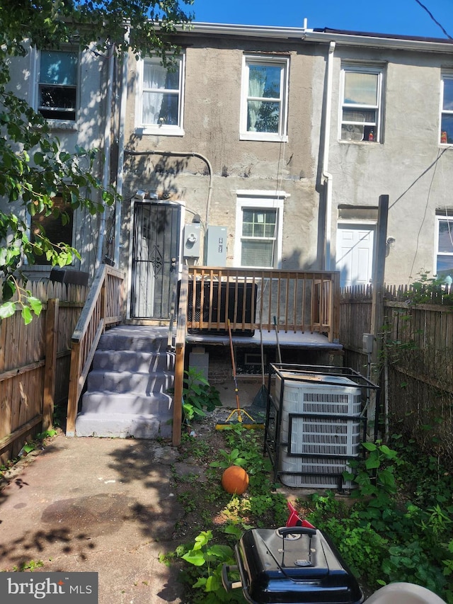1337 Ward St, Baltimore, MD 21230 - back of house with cooling unit and stucco siding