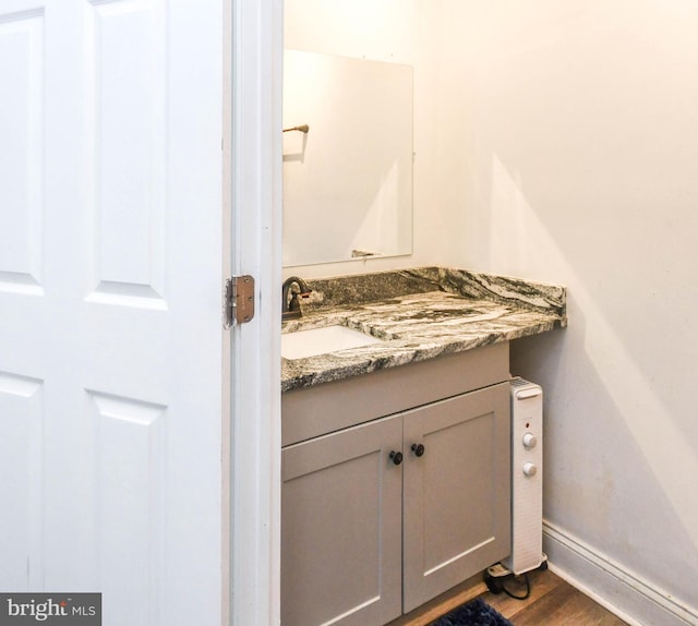 1337 Ward St, Baltimore, MD 21230 - bathroom featuring vanity, wood finished floors, and baseboards