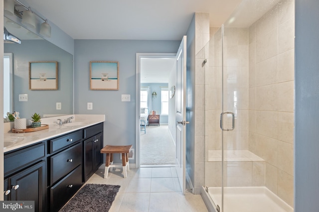 9629 Glassy Creek Way, Upper Marlboro, MD 20772 - bathroom with double vanity, a stall shower, tile patterned flooring, and baseboards