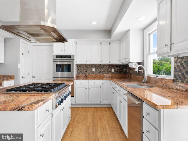7100 Ewing Ct, Middletown, MD 21769 - kitchen with island exhaust hood, appliances with stainless steel finishes, white cabinetry, light stone countertops, and recessed lighting