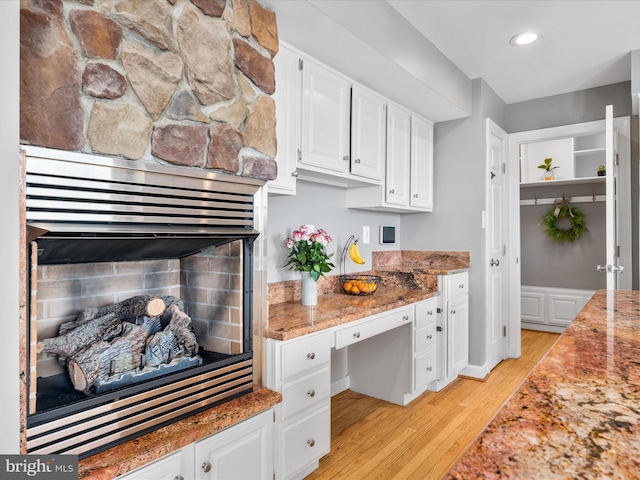 7100 Ewing Ct, Middletown, MD 21769 - kitchen featuring light wood-style flooring, white cabinetry, recessed lighting, and built in desk