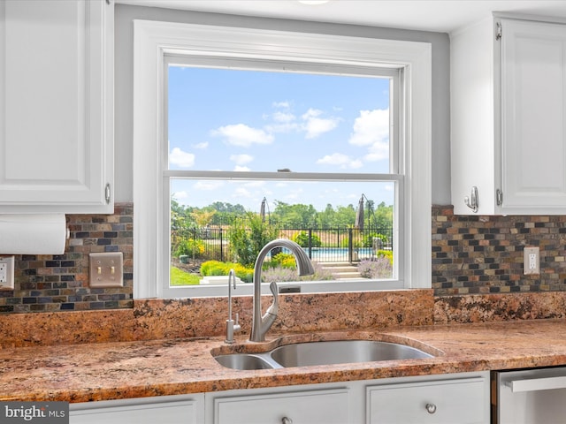7100 Ewing Ct, Middletown, MD 21769 - kitchen with dishwasher, white cabinetry, tasteful backsplash, and healthy amount of natural light