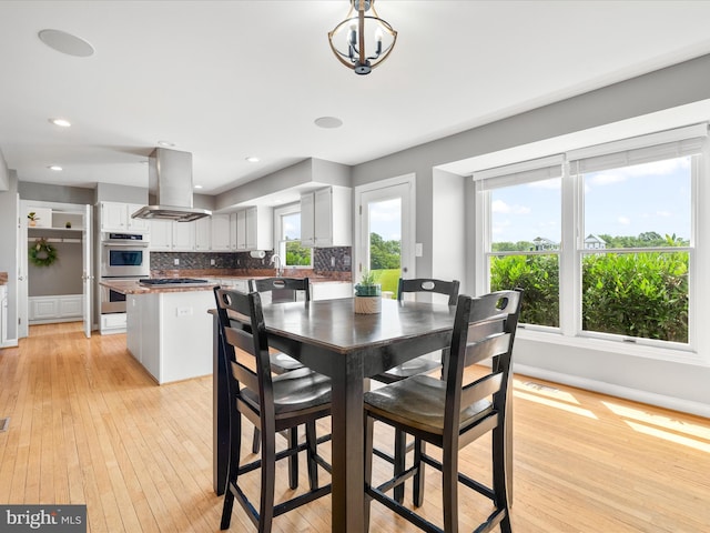 7100 Ewing Ct, Middletown, MD 21769 - dining space with light wood-type flooring, recessed lighting, and a chandelier