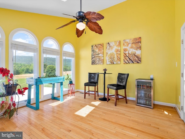 7100 Ewing Ct, Middletown, MD 21769 - living area with beverage cooler, a ceiling fan, and wood-type flooring