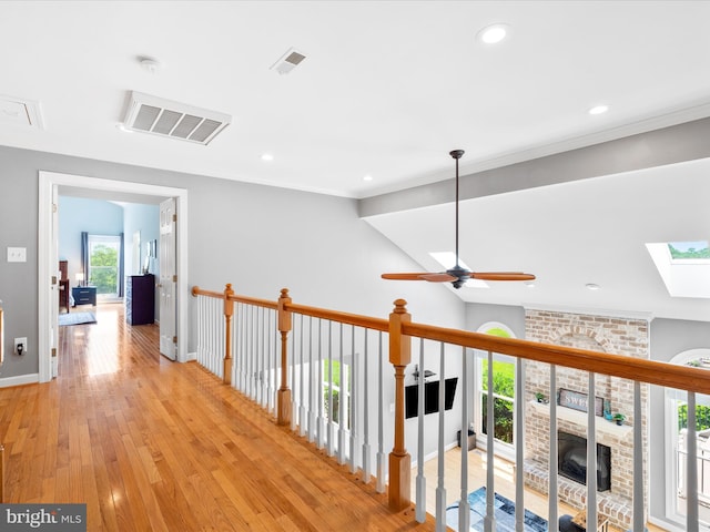 7100 Ewing Ct, Middletown, MD 21769 - corridor featuring light wood-style floors, a skylight, recessed lighting, and ornamental molding