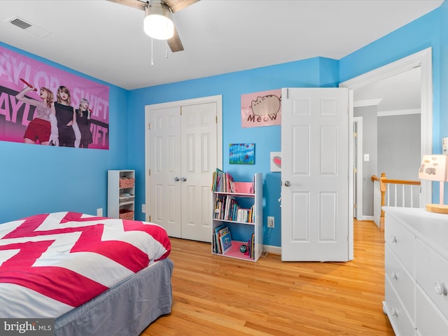 7100 Ewing Ct, Middletown, MD 21769 - bedroom with a closet, wood finished floors, ornamental molding, and a ceiling fan