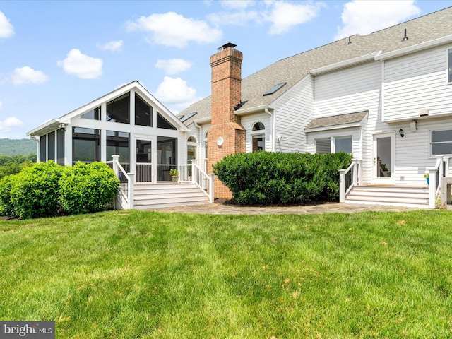7100 Ewing Ct, Middletown, MD 21769 - rear view of property with a sunroom, a yard, roof with shingles, and a chimney