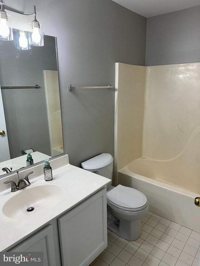 14208 Creekbranch Way, Gainesville, VA 20155 - full bath featuring tile patterned flooring, toilet, vanity, and washtub / shower combination