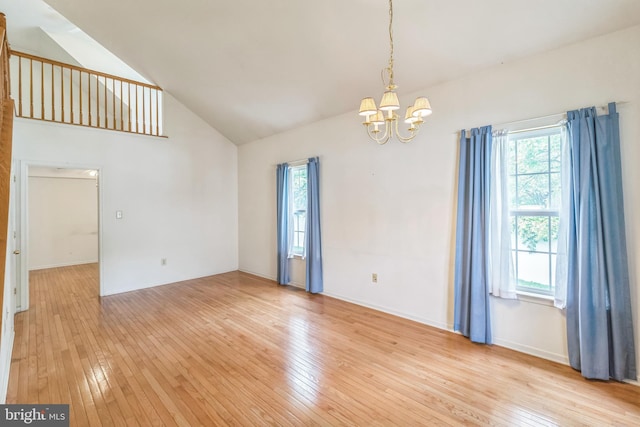 22 Regents Ct, Bensalem, PA 19020 - unfurnished room with a chandelier, light wood-style flooring, plenty of natural light, and high vaulted ceiling