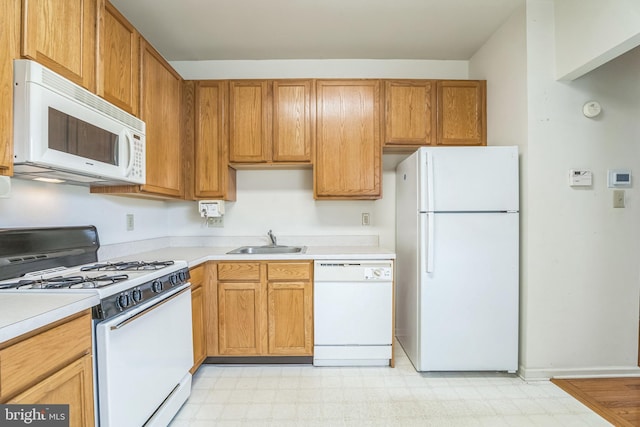 22 Regents Ct, Bensalem, PA 19020 - kitchen with white appliances, a sink, light flooring, and light countertops