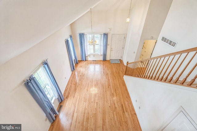 22 Regents Ct, Bensalem, PA 19020 - entryway with high vaulted ceiling, light wood-style flooring, a chandelier, and stairway