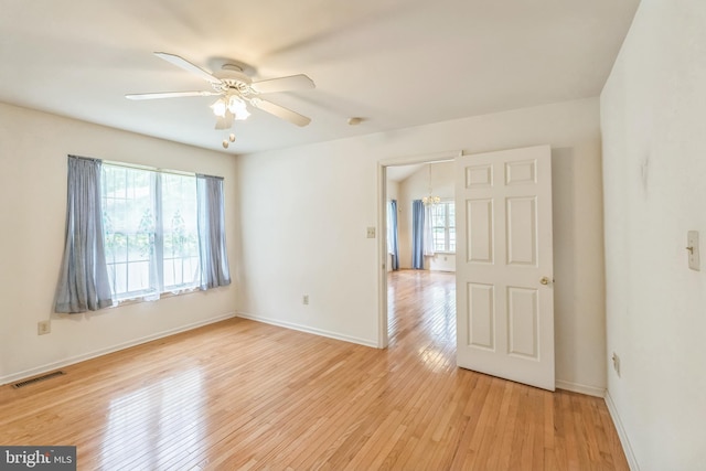 22 Regents Ct, Bensalem, PA 19020 - unfurnished room featuring ceiling fan, light wood-style floors, baseboards, and a chandelier