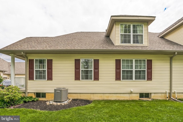 22 Regents Ct, Bensalem, PA 19020 - view of side of property with cooling unit, a lawn, and a shingled roof